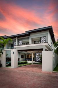 a rendering of a house with a sunset at Serenity Jomtien Pool Villas in Jomtien Beach