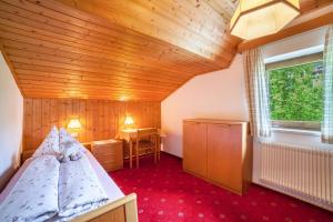 Łóżko lub łóżka w pokoju w obiekcie Sankt Corbinian Apartement 9