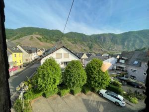 a view of a town with a car parked on a street at Gästehaus Trulla in Bremm