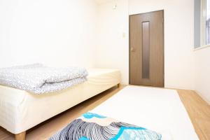 Giường trong phòng chung tại it senriyama 203
