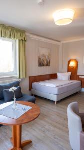 Postel nebo postele na pokoji v ubytování Hotel Am Uenglinger Tor