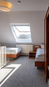 Postel nebo postele na pokoji v ubytování Hotel Am Uenglinger Tor