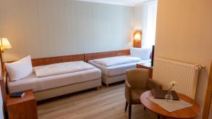 Postel nebo postele na pokoji v ubytování Hotel Am Uenglinger Tor