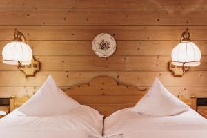 Postel nebo postele na pokoji v ubytování Heimspitze - Alpenhotel & Wirtshaus