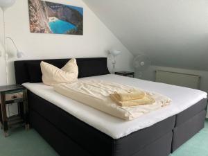 Ein Bett oder Betten in einem Zimmer der Unterkunft Apartmentcenter Koblenz