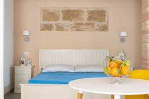 Ένα ή περισσότερα κρεβάτια σε δωμάτιο στο Carmencita Apartment