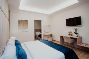 Postel nebo postele na pokoji v ubytování Cesare ai Cavalieri Suites