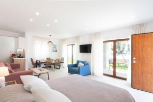 A television and/or entertainment centre at Villa Dafni - Infinite Sea Vistas with Private Pool