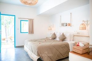 Voodi või voodid majutusasutuse The Koho Air Hotel toas