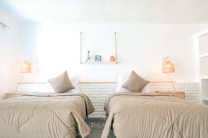Voodi või voodid majutusasutuse The Koho Air Hotel toas