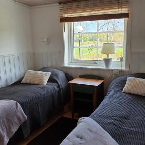 Postel nebo postele na pokoji v ubytování Torpet Gårdsvägen