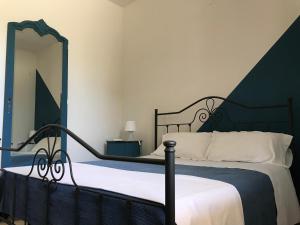 A bed or beds in a room at B&B La Roverella