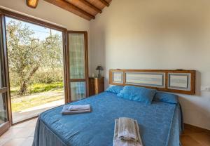 Ένα ή περισσότερα κρεβάτια σε δωμάτιο στο Agriturismo Valle dei Venti