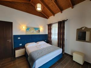 A bed or beds in a room at Villa JIOTA