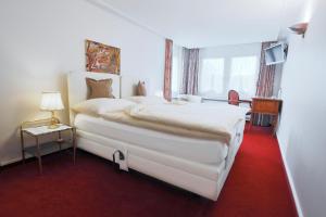 Voodi või voodid majutusasutuse Hotel & Spezialitätenrestaurant zur Linde toas