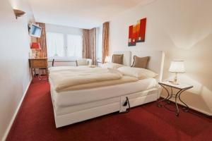 Voodi või voodid majutusasutuse Hotel & Spezialitätenrestaurant zur Linde toas