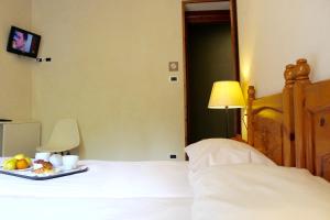 Postel nebo postele na pokoji v ubytování Hotel Miramonti Family & SPA