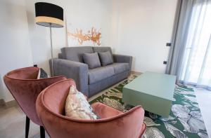 a living room with two chairs and a couch at ON City Apartments in Matalascañas