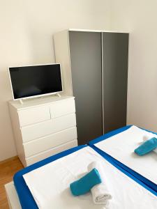 Postel nebo postele na pokoji v ubytování Apartments LucMar