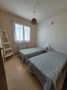 Postel nebo postele na pokoji v ubytování Délice des Dunes