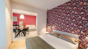 Ένα ή περισσότερα κρεβάτια σε δωμάτιο στο Vietti Apartments