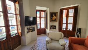 TV a/nebo společenská místnost v ubytování Exclusivo Apartamento en Linares