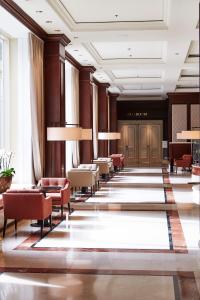 a lobby of a hotel with chairs and tables at Steigenberger Icon Wiltcher's in Brussels