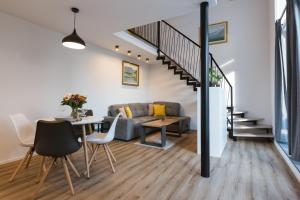 a living room with a couch and a table at Vila Rina in Bled