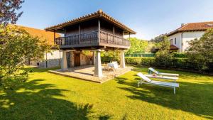 Zahrada ubytování Casa en la Costa con wifi, jardín y barbacoa