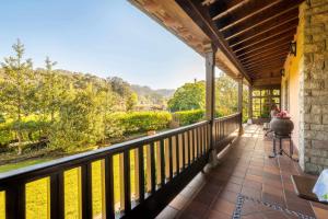 Balkon atau teras di Casa en la Costa con wifi jardín y barbacoa