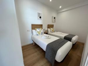 A bed or beds in a room at Oktheway Perbes Beach 2