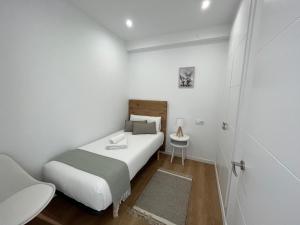 A bed or beds in a room at Oktheway Perbes Beach 2