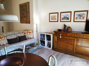 a living room with a couch and a table at Casa Sorianna in Montenegro de Cameros