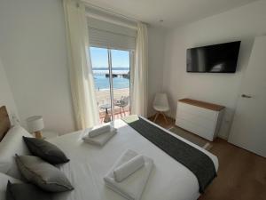 A bed or beds in a room at Oktheway Perbes Beach 2