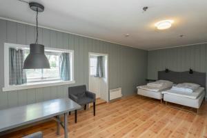 Postel nebo postele na pokoji v ubytování Nermo Hotel & Apartments