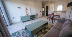 a living room with a couch and a table at ON City Apartments in Matalascañas