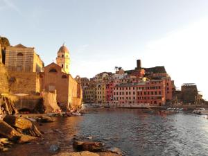a view of a river with buildings and a city at Elicriso Apartment Affittacamere in Borzonasca