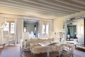 a living room with a couch and a table at Hotel Palazzina Grassi in Venice +37 photos