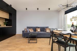 Posedenie v ubytovaní Apartament Przystań Letnica by Noclegi Renters