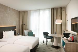 Cama ou camas em um quarto em Hyatt Place Frankfurt Airport