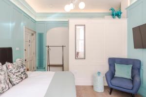 Voodi või voodid majutusasutuse 4 Berkeley Square I Your Apartment toas