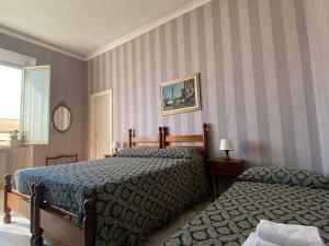 Postel nebo postele na pokoji v ubytování Hotel Le Najadi + 9 fotografií