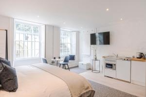 Voodi või voodid majutusasutuse 4 Berkeley Square I Your Apartment toas