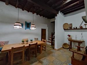 a dining room with a wooden table and chairs at Can Pep Frit in Ibiza Town