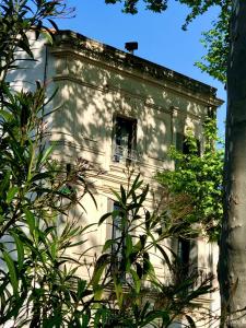 a building with a window on the side of it at La promesse de l aude in Sallèles-dʼAude