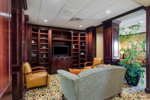 a living room with a couch and a television at Comfort Inn & Suites Denison - Lake Texoma in Denison