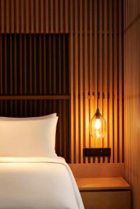 Ein Bett oder Betten in einem Zimmer der Unterkunft Park Hyatt Jakarta