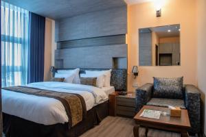 Postel nebo postele na pokoji v ubytování Sunshine Boutique Hotel + 23 fotografií