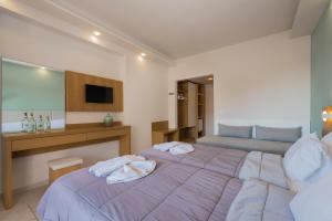 Postel nebo postele na pokoji v ubytování Dennys Inn Hotel