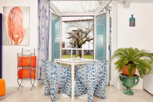 a dining room with a table and a window at Sweet Sissi in Ljubljana